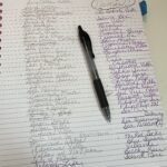 Pen on notebook list of villa names