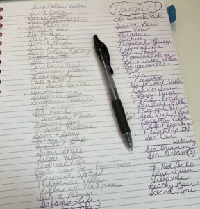 Pen on notebook list of villa names