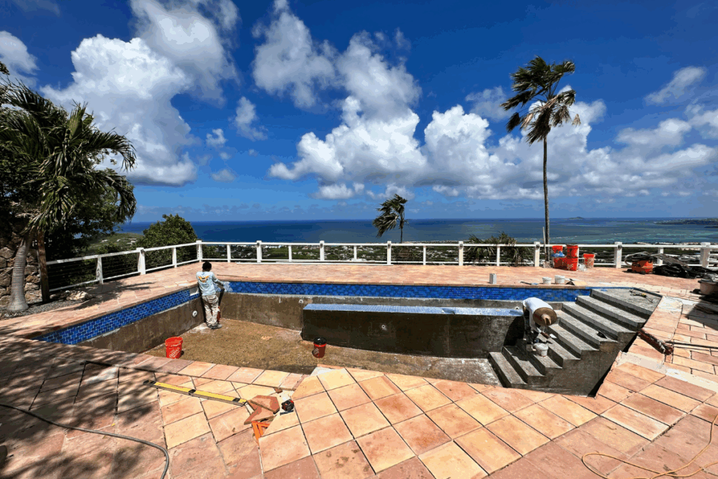 New water line, steps, and bench seat tile being set